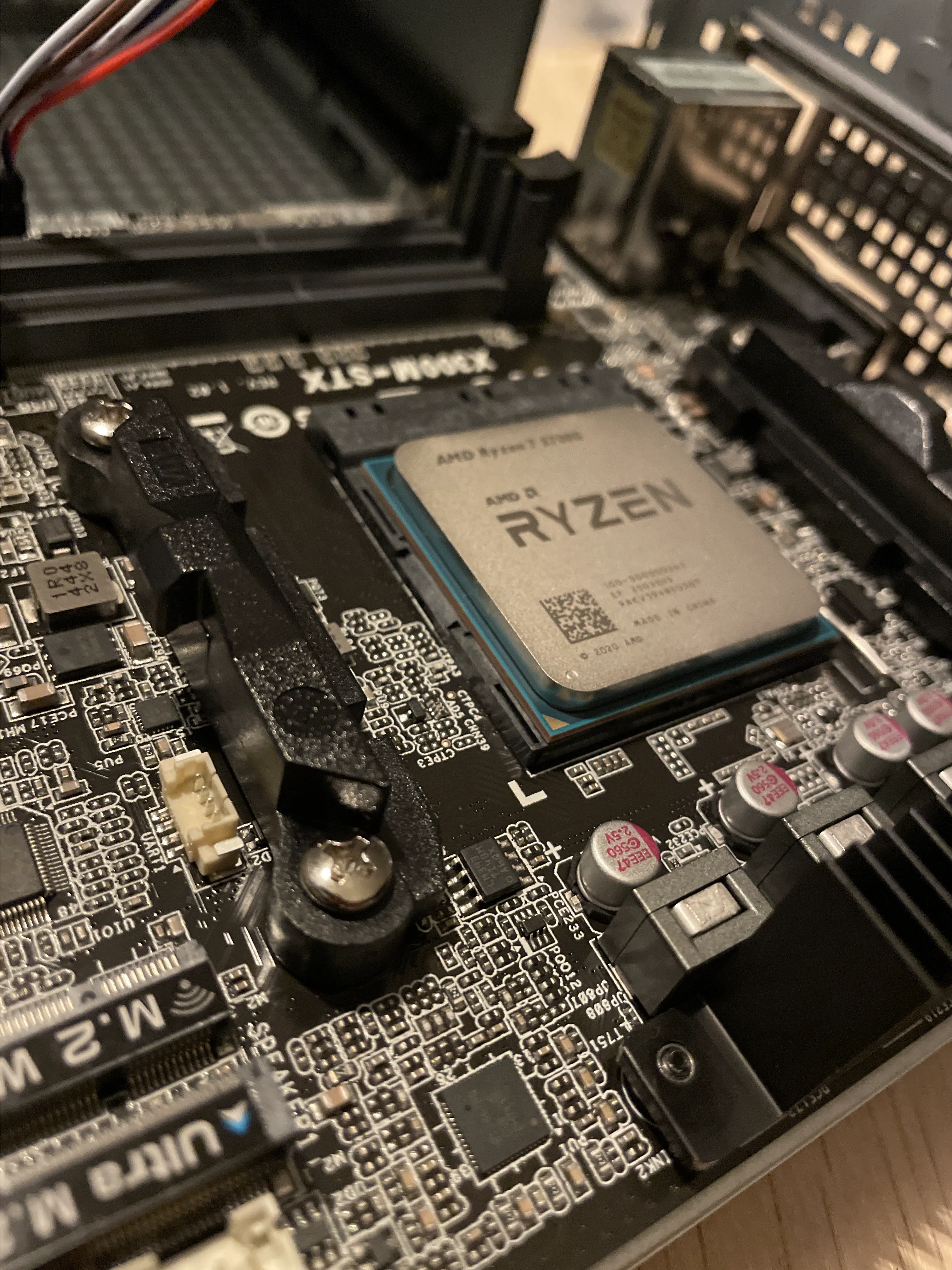 AMD Ryzen 7 5700G processor installed on the motherboard during assembly of the game server